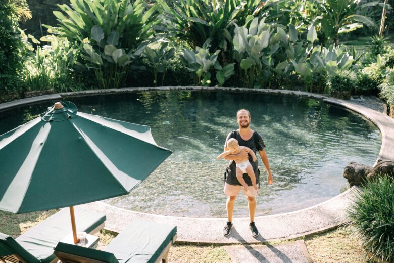 British family enjoying an all-inclusive resort in Marrakech, Morocco, with a vibrant pool and traditional architecture, highlighting luxury, cultural immersion, and family fun.